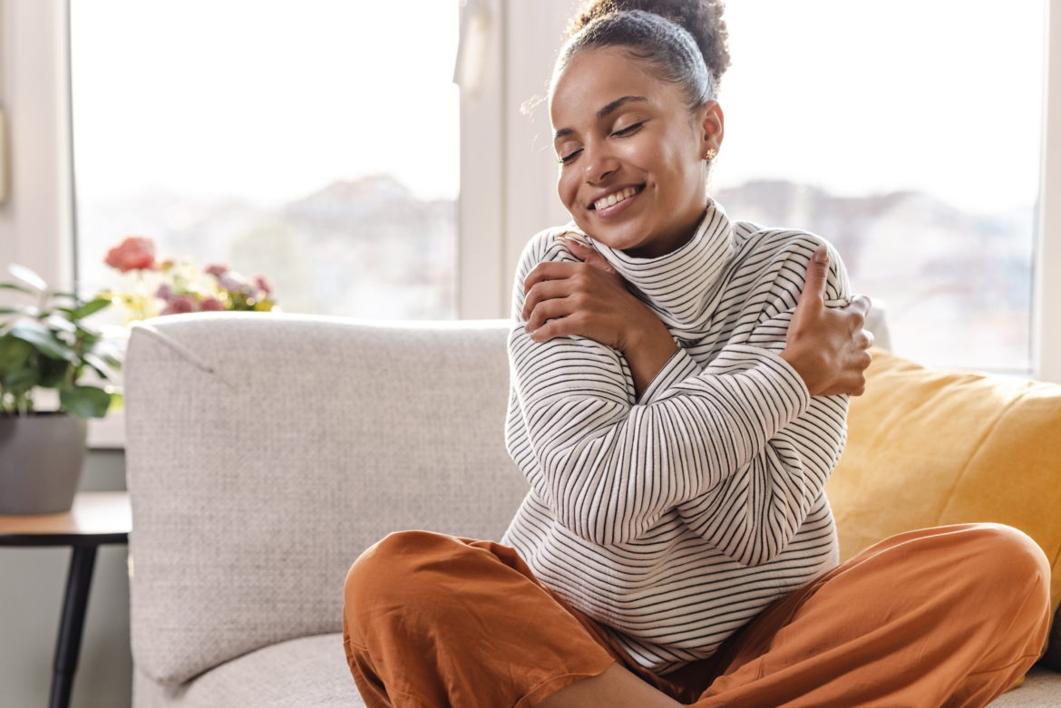 Mental Health Provider Self-Care, woman hugging herself.