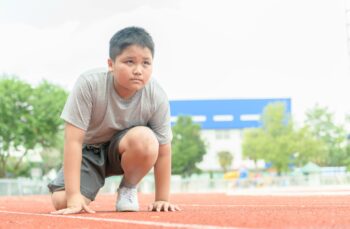 boy in starting position ready for running.