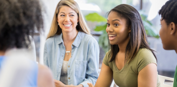 Teen and family in therapy session.