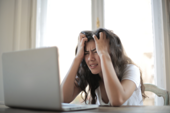 Stressed teen at laptop